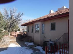 Seamless rain gutter on a pitched roof home.