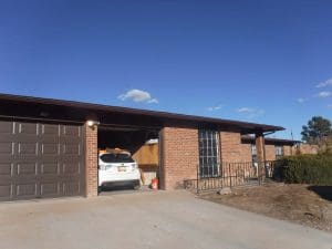 Seamless rain gutter on a pitched roof home.