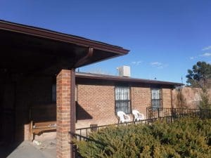 Seamless rain gutter on a pitched roof home.