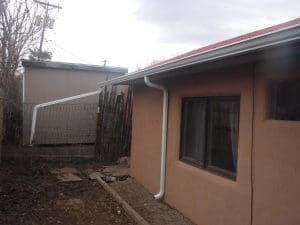 From our photo portfolio. Seamless rain gutter on a pitched roof home.