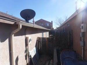 Seamless rain gutter on a pitched roof home.