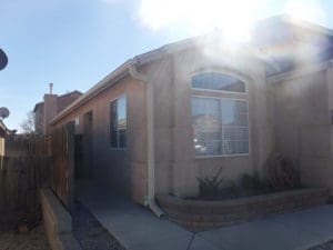 Seamless rain gutter on a pitched roof home.